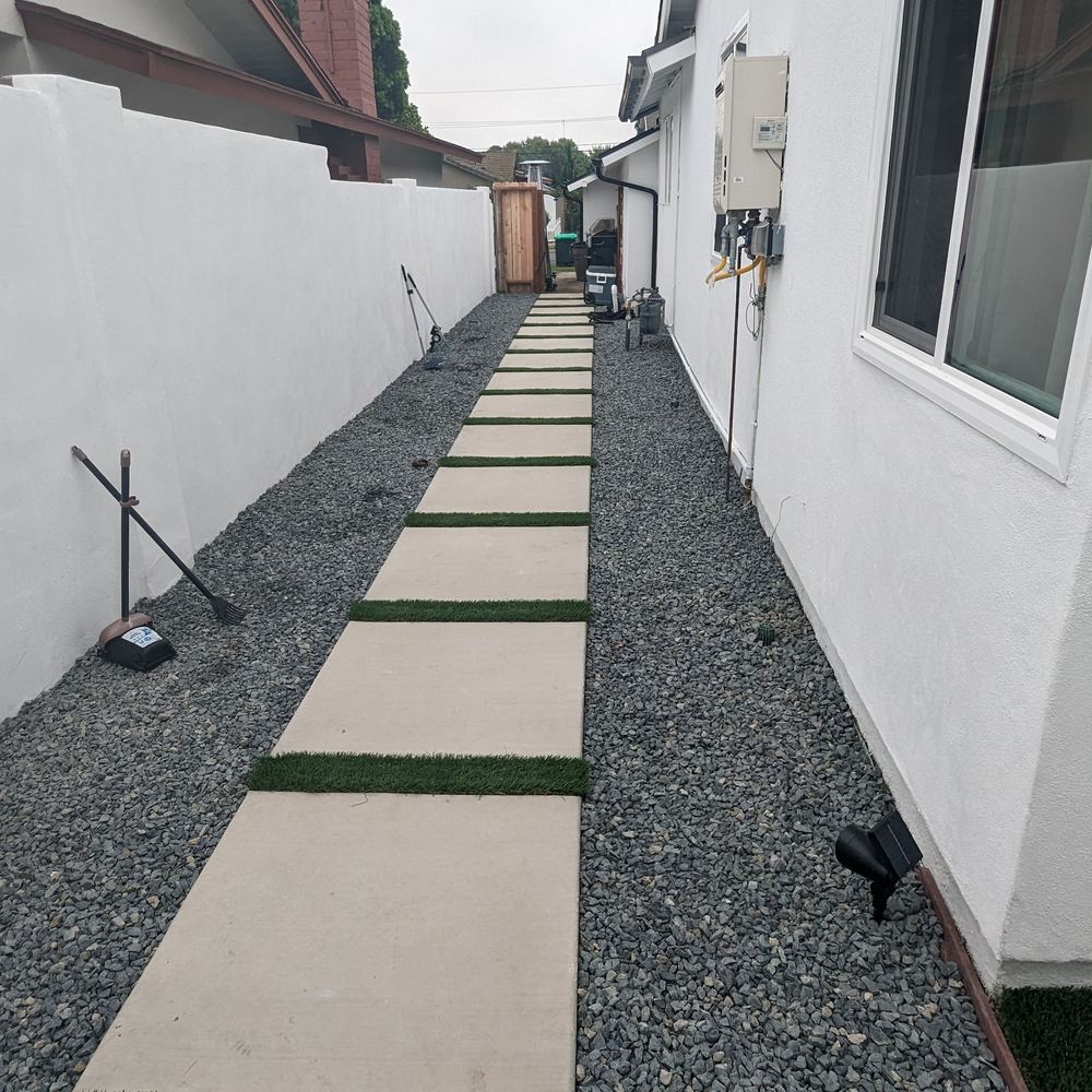 Side yard with concrete stepping pads set in gravel